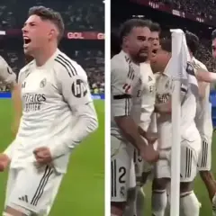 Jubelnde Fußballer in weißen Trikots. Federico Valverde feiert mit seinen Teamkollegen einen wichtigen Sieg.