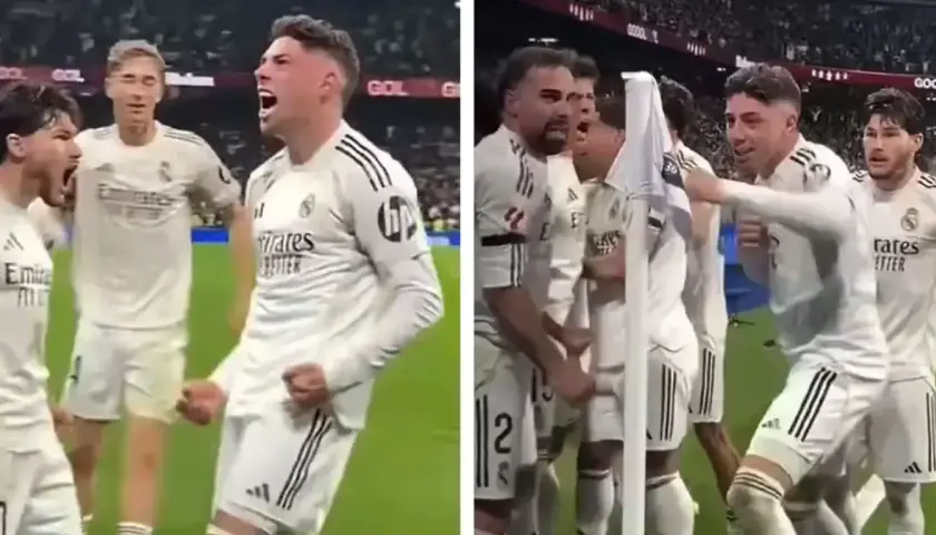 Jubelnde Fußballer in weißen Trikots. Federico Valverde feiert mit seinen Teamkollegen einen wichtigen Sieg.